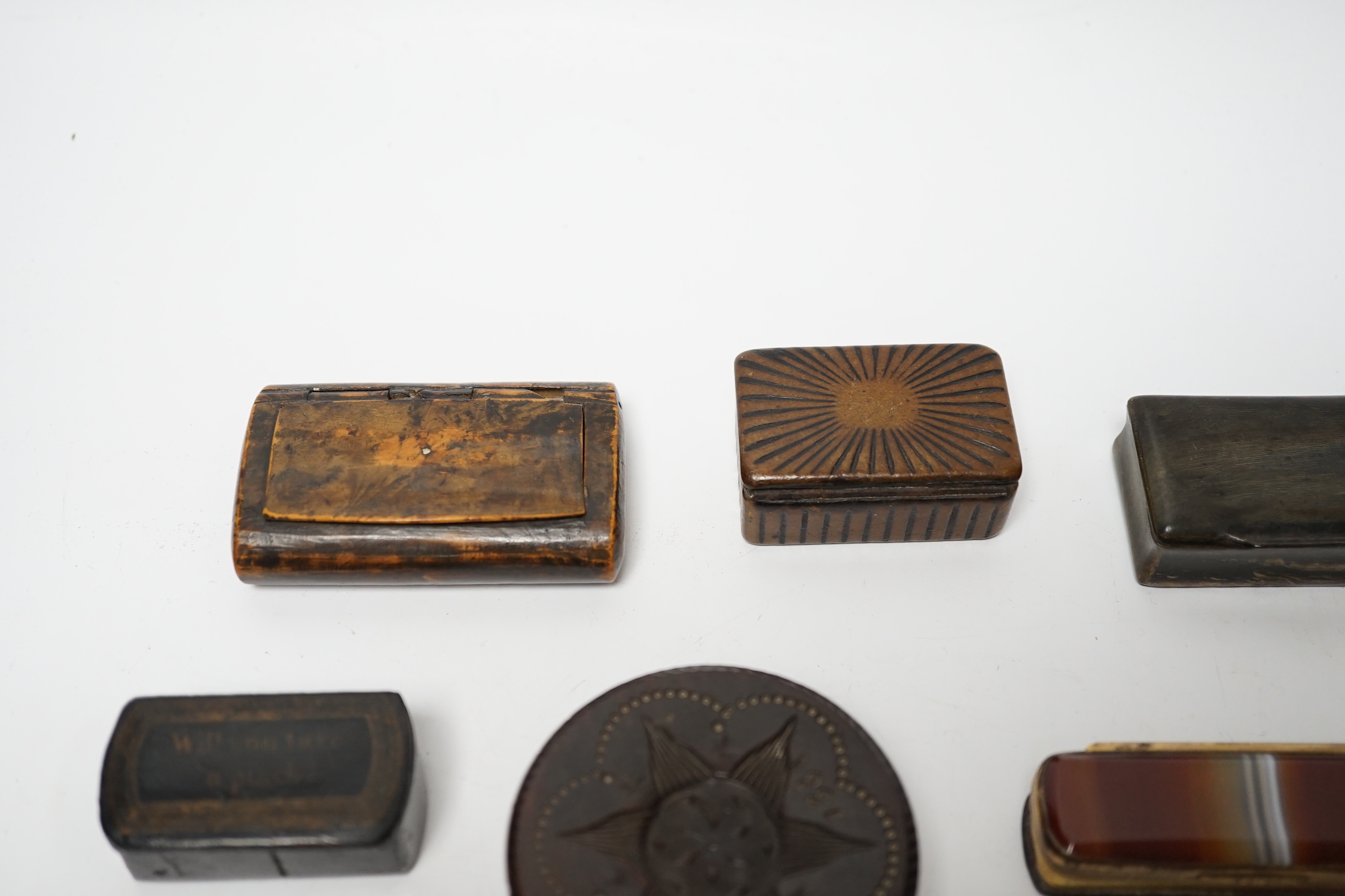 A collection of ten snuff boxes in tortoiseshell, treen or horn, etc.